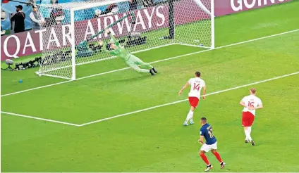  ?? ?? Rocket: Kylian Mbappe (left and above) fires home France’s second goal
Milestone: Olivier Giroud (left) celebrates becoming his country’s record goalscorer