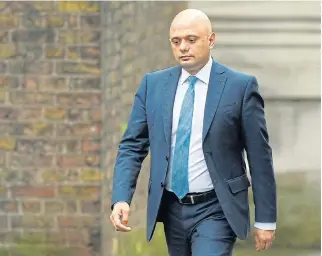  ?? Reuters ?? Coming and going: Britain’s finance minister, Sajid Javid, arrives at Downing Street in London on Thursday, when he resigned.
/