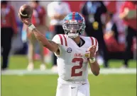  ?? Chris O’Meara / Associated Press ?? Ole Miss quarterbac­k Matt Corral throws a pass against Indiana during the first half of the Outback Bowl in Tampa, Fla., on Saturday.