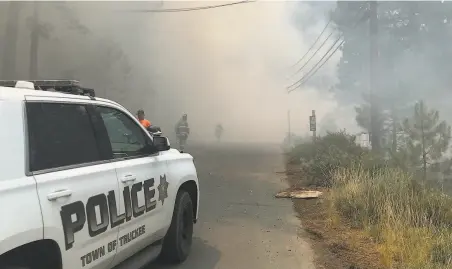  ?? Provided by Truckee Police Department ?? Emergency crews and law enforcemen­t respond to a plane crash in Truckee. Officials confirmed six people died in the crash.