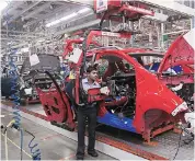  ?? PHOTO: REUTERS ?? Employees work on a Chevrolet Beat car on an assembly line at the General Motors plant in Talegaon, Mumbai