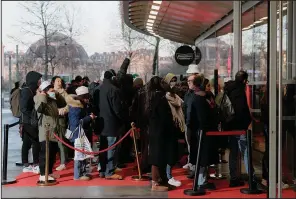  ?? (The New York Times/Violette Franchi) ?? People line up at Krispy Kreme on the chain’s opening day in Paris on Wednesday.