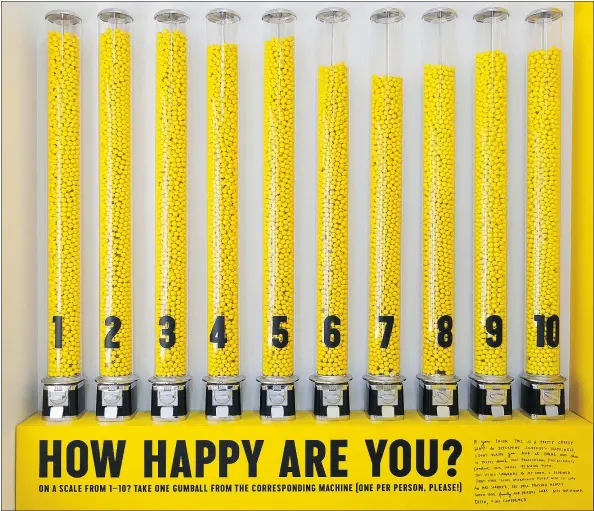  ??  ?? Gumball dispensers used as happiness gauges in The Happy Show, which is visiting the Museum of Vancouver as part of its current tour.