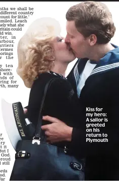  ??  ?? Kiss for my hero: A sailor is greeted on his return to Plymouth