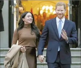  ?? Frank Augstein Associated Press ?? BRITAIN’S Prince Harry and Meghan, Duchess of Sussex, shown Jan. 7, 2020, in London, said racism and lack of support compelled them to exit their royal roles.