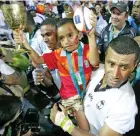  ?? Photo: Zimbio ?? Waisale Serevi Jnr lifts the Melrose Cup during the 2005 Rugby World Cup 7s in Hong Kong.