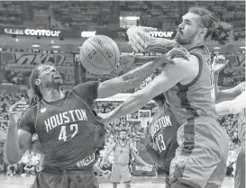  ?? Brett Coomer / Houston Chronicle ?? Rockets center Nene (42) was more than willing to engage in a paint-ball battle with Thunder counterpar­t Steven Adams on Sunday afternoon.
