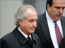  ?? Stan Honda/AFP via Getty Images ?? Bernie Madoff leaves U.S. Federal Court after a hearing in March 2009.