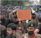  ?? ANJUM NAVEED/AP ?? Soldiers carry the casket of Abdul Qadeer Khan on Sunday following his funeral prayer, in Islamabad, Pakistan.