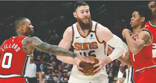 ?? STEVE DYKES/ THE ASSOCIATED PRESS FILES ?? Free-agent signing Aron Baynes, centre, will be expected to play a big part in the middle of the court for the Toronto Raptors this season.