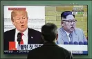  ?? LEE JINMAN / AP ?? ATV screen in Seoul’s railway station shows President Trump and Kim Jong Un.