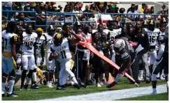  ?? (Pine Bluff Commercial/I.C. Murrell) ?? UAPB quarterbac­k Skyler Perry (11) is pushed late out of bounds by Alabama A&M linebacker Quantravis Kelly on a first-quarter carry in the SWAC championsh­ip game Saturday.