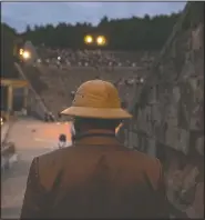  ??  ?? A man enters the ancient theater of Epidaurus to listen a solo concert by Kavakos.