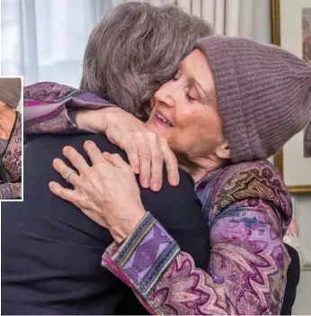  ??  ?? Emotional: Theresa May and Baroness Jowell share an embrace yesterday