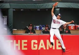  ?? (TNS) ?? IN HIS first start in the majors on Sunday night, Minnesota Twins outfielder Zach Granite catches a deep line drive off the bat of the Baltimore Orioles’ Manny Machado in the fourth inning of the Twins’ 11-5 home loss to the Orioles.