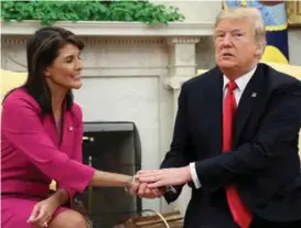  ?? FOTO: JONATHAN ERNST, REUTERS ?? FIKK ROS: FN-ambassadør Nikki Haley fikk ros av president Donald Trump for arbeidet hun hadde gjort, da hun leverte sin oppsigelse.