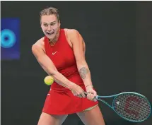  ?? Phil Walter/Getty Images ?? Aryna Sabalenka plays a backhand in a third-round match against Lesia Tsurenko on Friday.