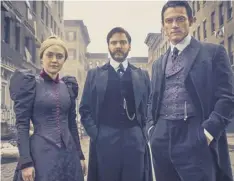  ??  ?? 0 Dakota Fanning, Daniel Bruhl and Luke Evans in The Alienist