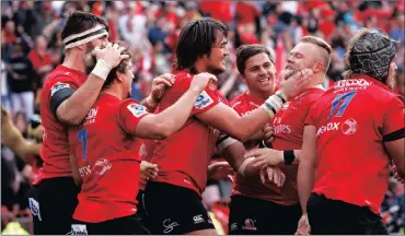  ?? Picture: KIM LUDBROOK, EPA ?? YOU ARE THE MAN, VAN: The Lions players congratula­te Akker van der Merwe after he played a big part in one of their tries in Saturday’s memorable comeback victory over the Hurricanes.