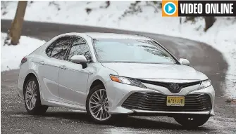 ?? STAFF PHOTO BY CHRISTOPHE­R EVANS ?? SMART LOOKING: The redesigned 2018 Toyota Camry Hybrid gives the appearance of an upscale, athletic road presence with stellar fuel savings.