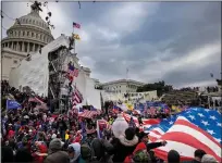  ?? OLIVIER DOULIERY — AFP VIA GETTY IMAGES ?? Supporters of President Donald Trump gather outside the US Capitol's Rotunda on Jan. 6, 2021, in Washington. Demonstrat­ors breeched security and entered the Capitol.