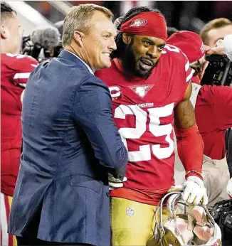  ?? TONY AVELAR / AP ?? 49ers GM John Lynch (left) celebrates with cornerback Richard Sherman, who was signed after being released by the Seahawks in 2018, during the NFC Championsh­ip game last week.