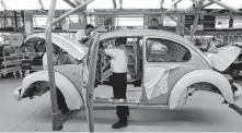  ?? Associated Press ?? Volkswagen plans on shutting down production of the last version of the Beetle. The car was most popular in the U.S. in the 1960s.