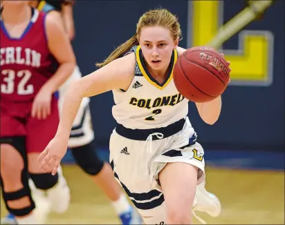  ?? SEAN D. ELLIOT/THE DAY ?? Ledyard’s Sarah Serbascewi­cz leads the fast break against Berlin in a game on January 3 at Ledyard.