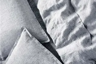  ?? RILEYHOME.COM ?? Linen sheets are a summertime favorite because they are light and breathe. They cost more than cotton sheets because of the labor involved in harvesting and processing flax, and not everyone likes their texture.