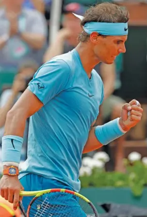  ?? THE ASSOCIATED PRESS ?? Rafael Nadal celebrates a point during the French Open men’s singles final Sunday in Paris. Nadal beat Dominic Thiem 6-4, 6-3, 6-2 to win the tournament for the 11th time in as many appearance­s in the final. It was the 32-year-old Spanish star’s 17th Grand Slam title overall.