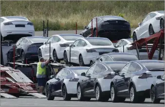  ?? BEN MARGOT — THE ASSOCIATED PRESS ?? After two more cuts to Model 3prices, Tesla's cheapest vehicle starts at $42,990. That doesn't include a $7,500 U.S. tax credit for electric vehicles that went into effect in January, which can bring the price to $35,500.