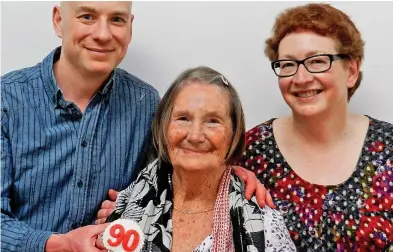  ??  ?? Celebratio­n: Mrs Blass smiles with her children Michael and Daphne on her 90th birthday