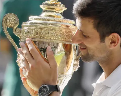  ?? AP ?? World number 21 Novak djokovic added the 2018 title to his wins in 2011, 2014 and 2015. —