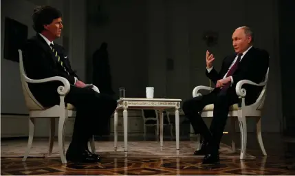 ?? AFP PHOTO ?? PUTIN INTERVIEW
Russian President Vladimir Putin grants an interview to US talk show host Tucker Carlson at the Kremlin, Moscow, on
Feb. 6, 2024.