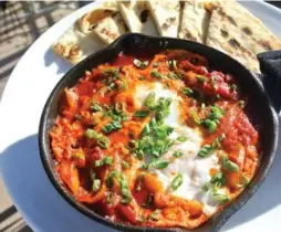  ?? SHLOMO’S DELI & GRILL ?? Shakshuka, a Middle Eastern dish of poached eggs atop a sauce of tomatoes, onions, peppers and spices, is a breakfast offering at Shlomo’s Deli & Grill.