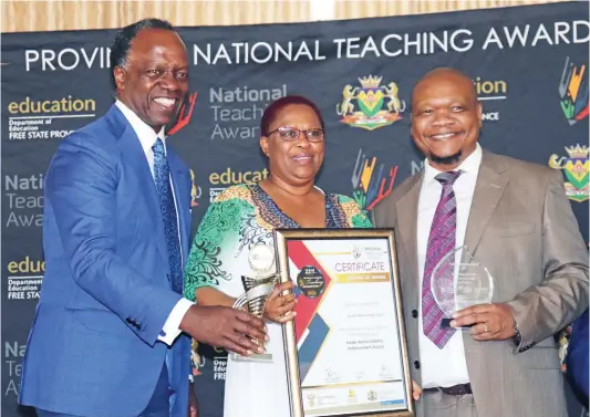  ?? ?? Keynote speaker, Sizwe Nxasana, Kader Asmal Lifetime Achievemen­t Award recipient, Seyanokeng Suzan Sejake, and Free State MEC for Education, Dr Tate Makgoe.