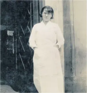  ??  ?? Pictured is Doris Newton on the steps of the Co-Op in Woodgate, Loughborou­gh in the 1930s.