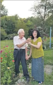  ??  ?? Courtesy of Linda Handwerk Lowell and Roseanne Peters stand in front of a bed of zinnias in their Bern Township garden. success?