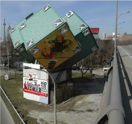  ?? DAVID COOPER PHOTO/TORONTO STAR ?? The three-apartment structure, standing on a pie-shaped slice of real estate between Adelaide St. E. and Eastern Ave., was built in 1996.