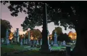 ?? MICHAEL S. WILLIAMSON / WASHINGTON POST ?? Congressio­nal Cemetery as the sun goes down in Washington, D.C., on Oct. 18.