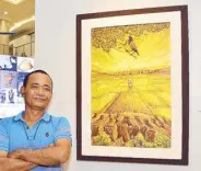  ??  ?? Guimaras artist Roberto Vargas and his “Changing Horizon III.” Roberto’s works are based on reality, changing its presentati­on on how he sees it.