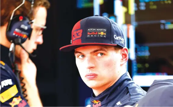  ??  ?? Red Bull driver Max Verstappen of the Netherland­s waits in his garage in the pit lane during the Formula One pre-season testing session at the Barcelona Catalunya racetrack. Photo: AP