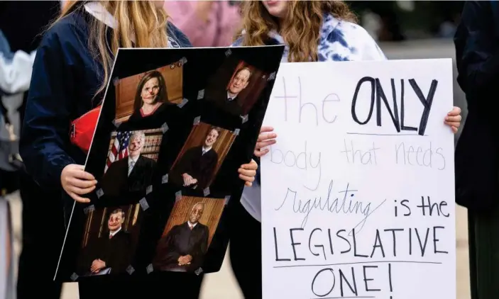  ?? Photograph: Jim Watson/AFP/Getty Images ?? Pro-choice demonstrat­ors outside the supreme court building in Washington on Thursday.