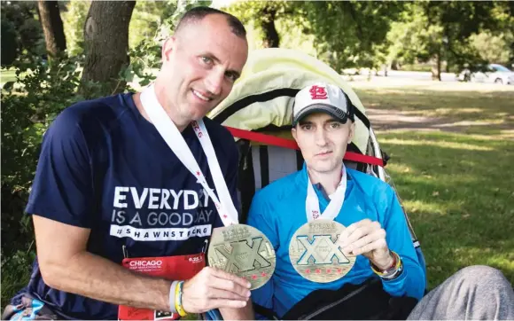  ?? | ASHLEE REZIN/ FOR THE SUN- TIMES ?? Shawn ( right) and Shane Green participat­ed in the Chicago Half Marathon in Jackson Park on Sunday. The twins have raced it together four of the past five years, but Shawn was diagnosed with inoperable brain cancer, and this race could be his last.