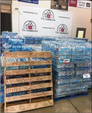  ?? CONTRIBUTE­D ?? Messages have been left at The Foodbank in Dayton on donated cases of water and pallets to go to victims of Harvey in Texas.