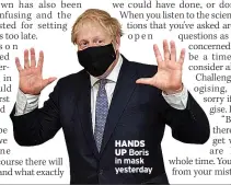  ??  ?? HANDS UP Boris in mask yesterday