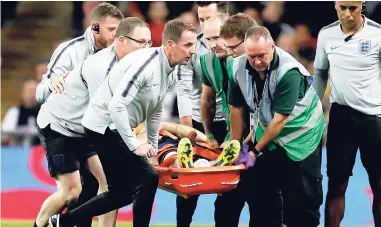  ?? AP ?? England’s Luke Shaw is carried off the pitch on a stretcher after he injured himself during the UEFA Nations League match between England and Spain at Wembley stadium yesterday.