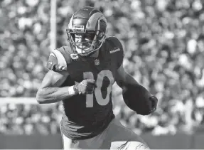  ?? BRAD PENNER/USA TODAY SPORTS ?? Rams wide receiver Cooper Kupp, seen running for a touchdown after a catch against the Giants, has 46 receptions this season.