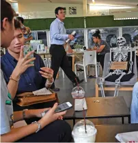  ?? AFP ?? patrons having drinks at the Kid mai Death Awareness cafe, an exhibition space built to educate the public about death and Buddhism, in Bangkok. —