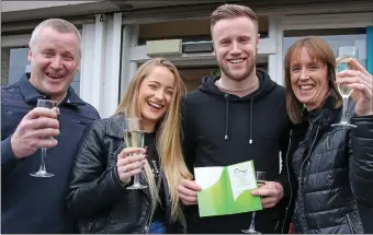  ??  ?? Kevin O’Connor with his parents Breda and Brian and girlfriend Chloe O’Leary with the winning ticket.